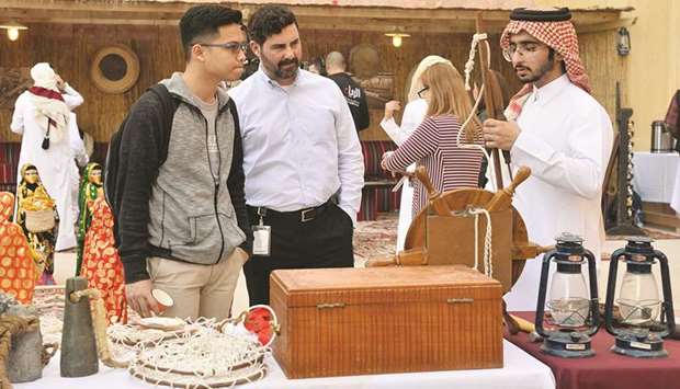 Dr Cesar Malave, dean, Tamuq, tries the traditional sword dance with some of the students. PICTURES: Noushad Thekkayil