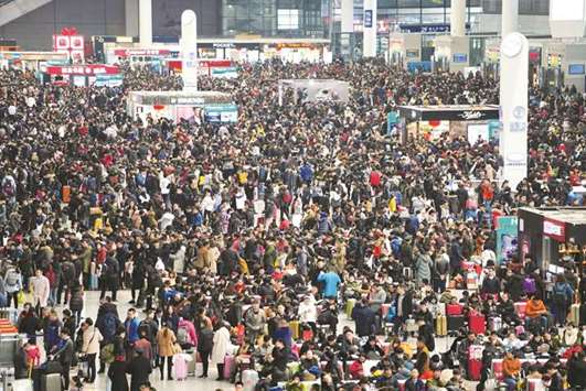 Passengers wait to board trains at Shanghaiu2019s Hongqiao Railway Station as the annual Spring Festival travel rush begins ahead of the Chinese Lunar New Year.