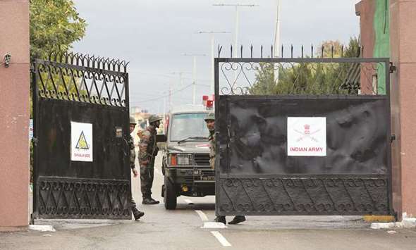 An army ambulance leaves Sunjuwan camp after it was attacked by militants, in Jammu yesterday.