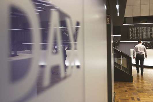 The German stock market index DAX is seen in a logo at the Frankfurt Stock Exchange. The index slumped 1.4% to 13,003.90 yesterday, driven lower by a 2.6% drop in shares in Daimler.