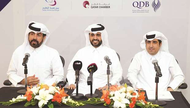 Al-Khalifa (centre) is joined by al-Mansoori (left) and al-Sharqi during the launch of the second edition of the u2018SME Excellence List 2018u2019 held yesterday in Doha.