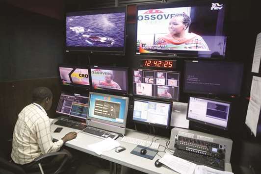 A man sits in a control centre of the NTV channel, which was shut down by the Kenyan government because of their coverage of opposition leader Raila Odingau2019s symbolic presidential inauguration this week, at the Nation group media building in Nairobi, yesterday.