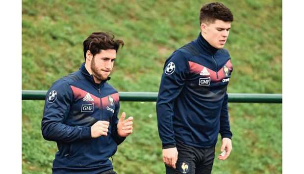 French scrumhalf Maxime Machenaud (left) and French flyhalf Matthieu Jalibert during a training session of the team for the upcoming Six Nations game against Ireland in Marcoussis. (AFP)