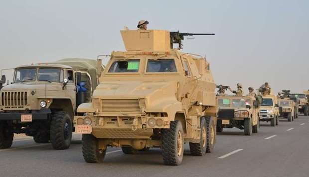 Egyptian Army's Armoured Vehicles are seen on a highway to North Sinai during a launch of a major assault against militants