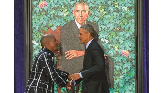 Former president Barack Obama yesterday joked about his ears and grey hair and praised his wife Michelle Obamau2019s u201chotnessu201d at the unveiling of the coupleu2019s official portraits at the Smithsonianu2019s National Portrait Gallery.