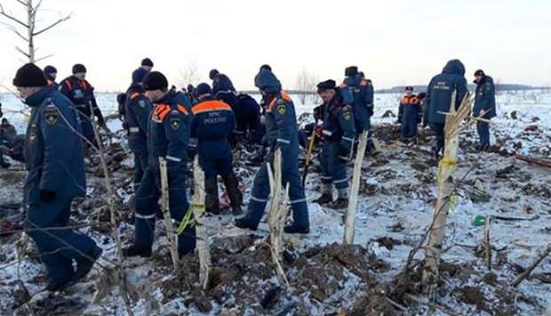 Rescuers working at the site of a plane crash in Ramensky district, near Moscow, on Tuesday.