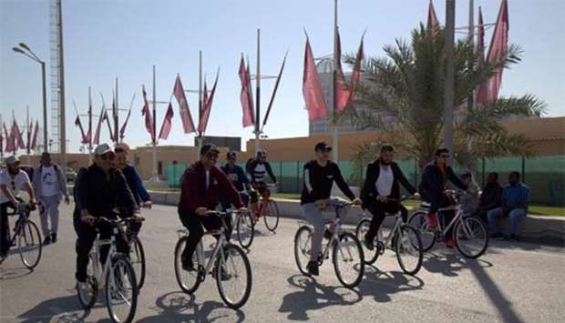 HE the Minister of Energy and Industry Dr Mohamed bin Saleh al-Sada and other dignitaries during a bicycle ride through Katara on Tuesday.