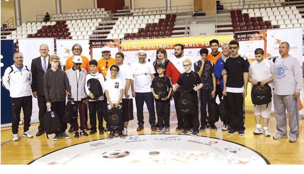 From left: Khaled Eid (Alnoor Institute), Rigard Du Plessis (general manager, Sasol), Massimiliano Montanari, Mohamed Hanzab, Yousuf Mohamed al-Jaida, Siham Alawami (director of Special Projects, Save the Dream), Faisal al-Kooheji (chairman, QSCCB), Luis Jimenez and Bora Milutinovi? with children from Alnoor Institute.