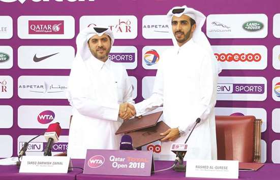 Qatar Tennis, Squash and Badminton Federation Secretary-General Tariq Darwish (left) and Qatar Tourism Authority Chief Marketing and Promotion Officer Rashed al-Qurese during the signing ceremony yesterday.