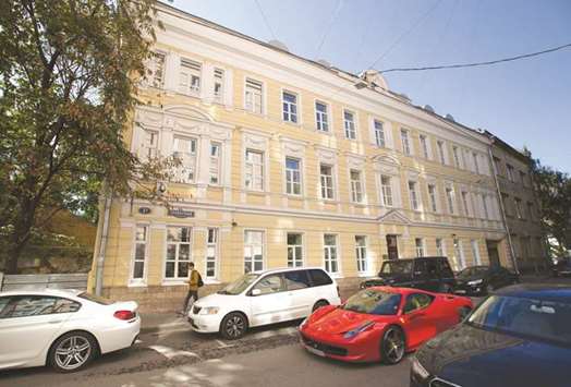 Vehicles pass the headquarters of En+ Group in Moscow (file). En+ has invited international banks to pitch for the sale of $1bn of shares in the company that manages the aluminium and hydropower businesses of Russian businessmen Oleg Deripaska, according to reports.