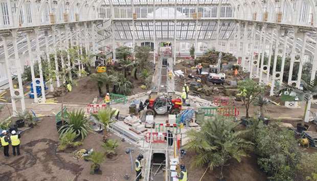 Work progresses inside the Temperate House, the largest surviving Victorian glasshouse in the world, during the final months of a five-year restoration at the Royal Botanic Gardens in Kew, west London.