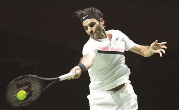 Switzerlandu2019s Roger Federer plays a forehand return against Ruben Bemelmans in Rotterdam yesterday.