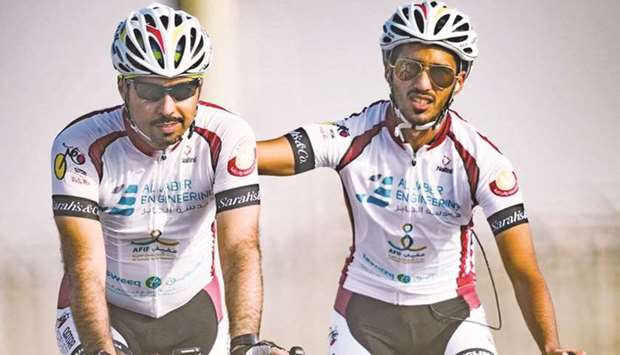 Dr Abdulaziz al-Kuwari (left) during a team race.
