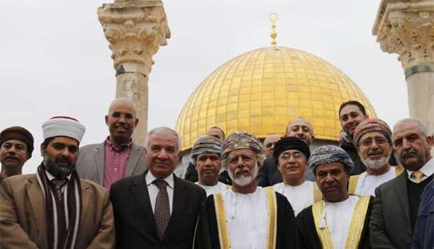 Oman's Minister Responsible for Foreign Affairs, Yusuf bin Alawi (centre), is pictured during his visit to Al-Aqsa mosque compound in Arab east Jerusalem, with the Dome of the Rock seen in the background.
