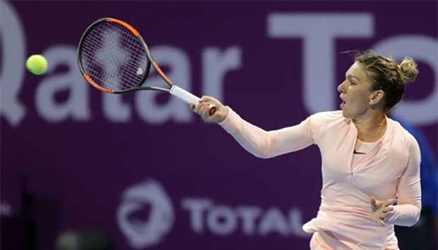 Simona Halep returns the ball to Anastasija Sevastova of Latvia in the Qatar Open in Doha on Thursday.