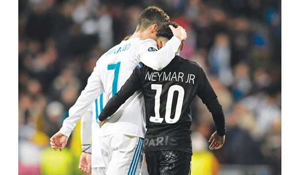 Real Madridu2019s forward Cristiano Ronaldo (left) and Paris Saint-Germainu2019s Brazilian forward Neymar leave the pitch at half-time during the UEFA Champions League round of 16 first leg match at the Santiago Bernabeu stadium in Madrid on Wednesday. (AFP)