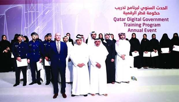 HE the Prime Minister and Interior Minister Sheikh Abdullah bin Nasser bin Khalifa al-Thani, HE the Minister of Transport and Communications Jassim Seif Ahmed al-Sulaiti and HEC Paris in Qatar dean and CEO Nils Plambeck with some of the successful graduates of the QDGTP programme on Thursday. PICTURE: Jayaram.