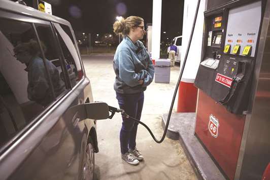 A customer fuels a vehicle at a gas station in Shelby, North Carolina. Gasoline prices in the US, which rose 7.1%, accounted for nearly half of the increase in the cost of goods last month.