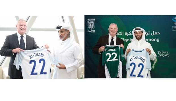 FA Chairman Greg Clarke presents a football jersey to QFA President Sheikh Hamad bin Khalifa bin Ahmed al-Thani. At right, Clarke with Supreme Committee Secretary-General hassan al-Thawadi.