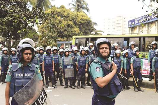 Bangladesh police stand guard in Dhaka yesterday.