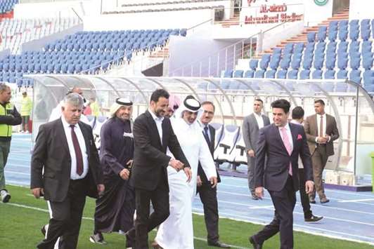 QFA President Sheikh Hamad bin Khalifa bin Ahmed al-Thani and CEO Hani Ballan are accompanied by Iraqi football officials during a tour of a stadium in Baghdad yesterday.