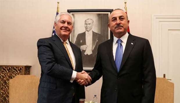 Turkish Foreign Minister Mevlut Cavusoglu shakes hands with US Secretary of State Rex Tillerson in Ankara on Friday.