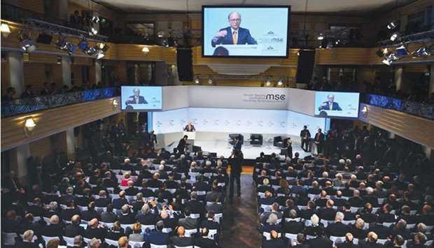 Wolfgang Ischinger, chairman of the Munich Security Conference (MSC), is displayed on giant screens as he gives a speech to open the 54th Munich Security Conference in Munich.