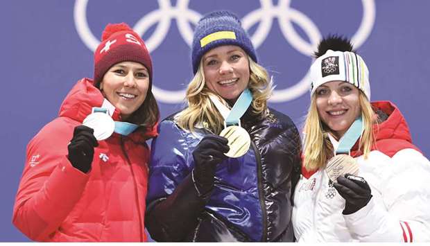 (L-R) Switzerlandu2019s silver medallist Wendy Holdener, Swedenu2019s gold medallist Frida Hansdotter and Austriau2019s bronze medallist Katharina Gallhuber pose on the alpine skiing slalom podium of the Pyeongchang 2018 Winter Olympic Games in Pyeongchang yesterday. Mikaela Shiffrin (inset) of the USA finishes fourth overall. (AFP)