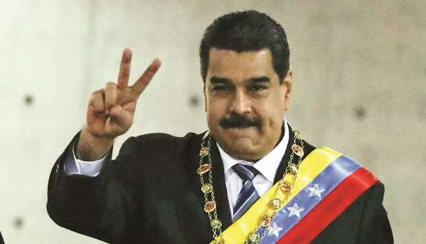 President Nicolas Maduro gestures as he arrives for a ceremony to mark the opening of the judicial year at the Supreme Court of Justice (TSJ) in Caracas, Venezuela.