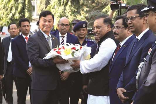 Myanmar Home Minister Gen Swe, left, receives floral wreath from his Bangladesh counterpart Asaduzzaman Khan in Dhaka on Friday. Bangladesh has handed over a list of more than 8,000 Rohingya to Myanmar as it moves to kick-start their repatriation weeks after the process was halted due to lack of preparation.