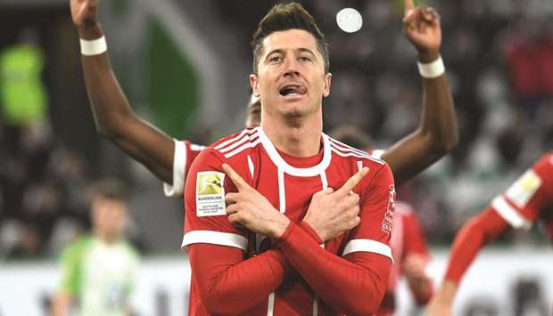 Bayern Munichu2019s Robert Lewandowski celebrates scoring the winning goal against Wolfsburg yesterday.
