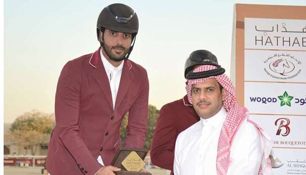 Awad al-Qahtani stayed in contention in the battle for the Big Touru2019s top three spots in the National Equestrian Tour as he returned to claim the top place of the class in Hathab 8 competition at the Qatar Equestrian Federation arena yesterday.