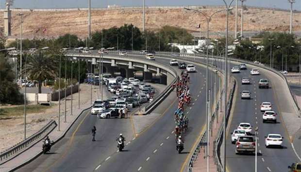 The pack rides during the sixth stage of the 2018 cycling Tour of Oman between al-Mouj Muscat to Matrah Corniche on Sunday.