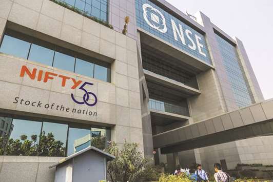 Employees enter the National Stock Exchange of India building in Mumbai (file). The Singapore Exchange is discussing a trading link with the NSE that would make Singapore a gateway to the NSEu2019s derivatives market in Gujarat, India.
