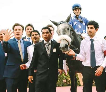 In this February 25, 2017, picture, trainer Julian Smart (left) celebrates his fifth HH The Emiru2019s Sword (Gr1 PA) victory after His Highness Sheikh Mohamed bin Khalifa al-Thaniu2019s Ebraz won under Alan Munro at the QREC. PICTURE: Juhaim