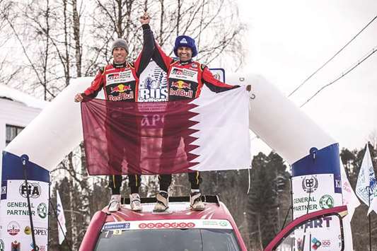 Qatari driver Nasser Saleh al-Attiyah (right) and French co-driver Mathieu Baumel celebrate their victory in the Baja Russia Northern Forest Rally, the first round of the 2018 FIA World Cup for Cross-Country Rallies, yesterday. (Twitter/MathieuBaumel)
