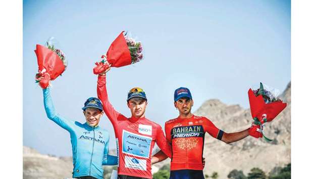 Kazakh rider Alexey Lutsenko (centre) of the Astana Pro Team celebrates on the podium with his Colombian teammate and runner-up Miguel Angel Lopez (left) and third place Gorka Izagirre of the Bahrain Merida team after the sixth and last stage between Al Mouj Muscat and Matrah Corniche in Muscat yesterday. (AFP)