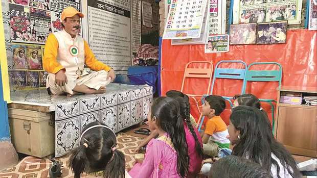 IN CHARGE: Baburao Laadsaheb teaches an acting course for slum children in Mumbai.