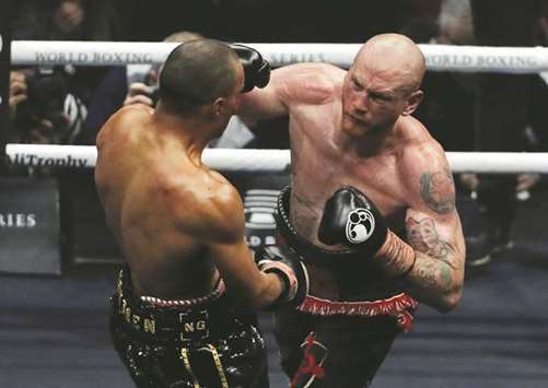 George Groves (right) lands a punch on Chris Eubank Jr during their World Boxing Super Series semi-final on Saturday. (Reuters)
