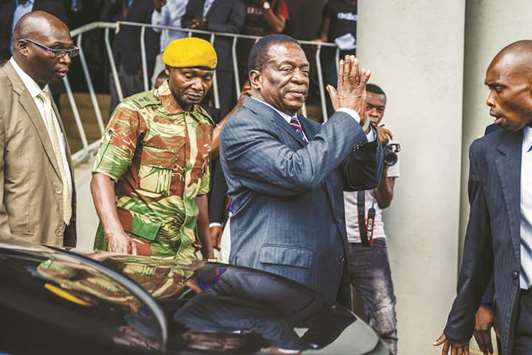 Zimbabweu2019s President Emmerson Mnangagwa salutes mourners at the home of late opposition leader Morgan Tsvangirai in Harare yesterday.
