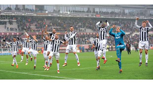Juventus celebrate in front of their fans at the end of the match against Torino yesterday.