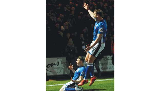 Rochdaleu2019s Steven Davies celebrates scoring their second goal against Tottenham yesterday.