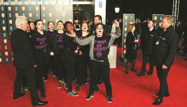 Protesters wearing T-Shirts that read u201cTimes Up Theresau201d get onto the red carpet at the British Academy Film Awards at the Royal Albert Hall in London yesterday.
