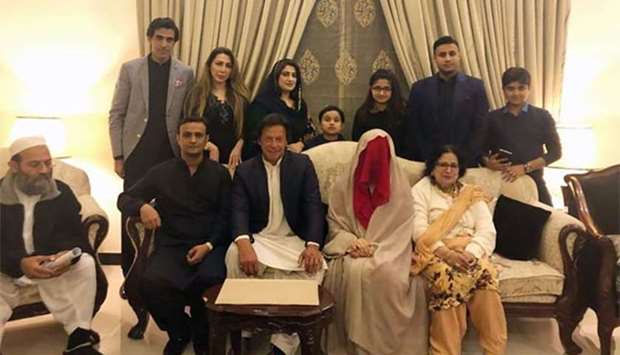 Imran Khan posing for a photograph with his new wife Bushra Wattoo along with relatives during a wedding ceremony in Lahore.