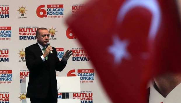 Recep Tayyip Erdogan attends the sixth ordinary provincial congress of Turkey's ruling AK Party at Ankara Sports Hall in Ankara yesterday.
