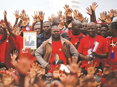 Mourners join a funeral parade for the late Movement For Democratic Change leader Morgan Tsvangirai in Harare.