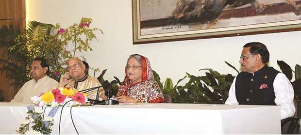 Bangladesh PM Sheikh Hasina addresses a press conference as other party leaders look on in Dhaka yesterday.