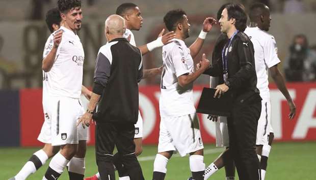 Qataru2019s Al Sadd players celebrate after winning the AFC Champions League group stage match against Al Wasl and at the Zabeel Stadium in Dubai on February 13, 2018.  (AFP)