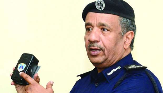 Brigadier Mohamed Saad al-Kharji displays the new smart device for impounding vehicles.