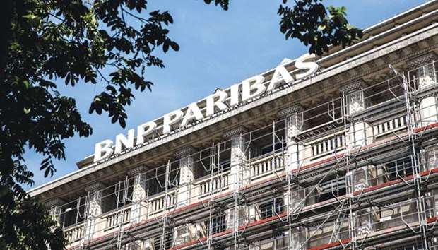 Construction scaffolding surrounds the BNP Paribas headquarters in Paris. BNP Paribas-ABN Amro deal is subject to regulatory approval and should be finalised by the third quarter, the two banks said in a statement yesterday.